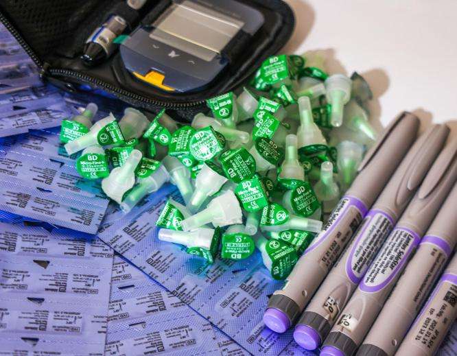 A pile of insulin pens and caps used to treat diabetes.